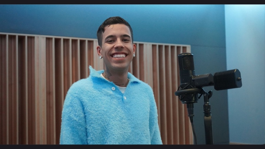 Artist smiling in the vocal booth