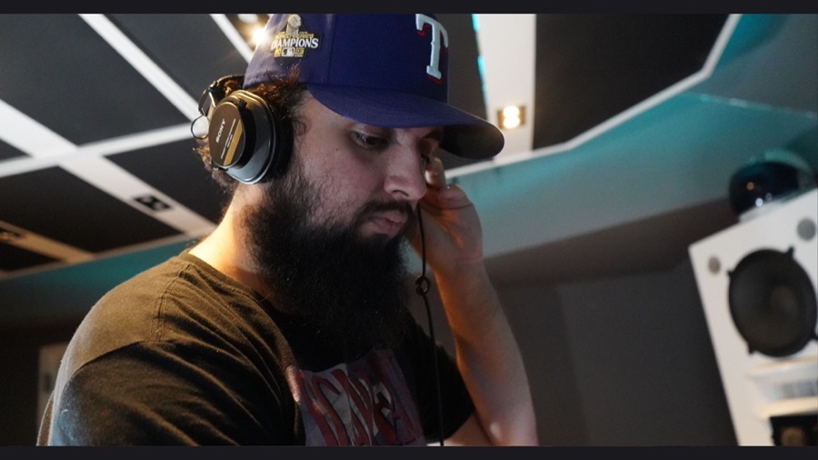 Engineer listening on headphones